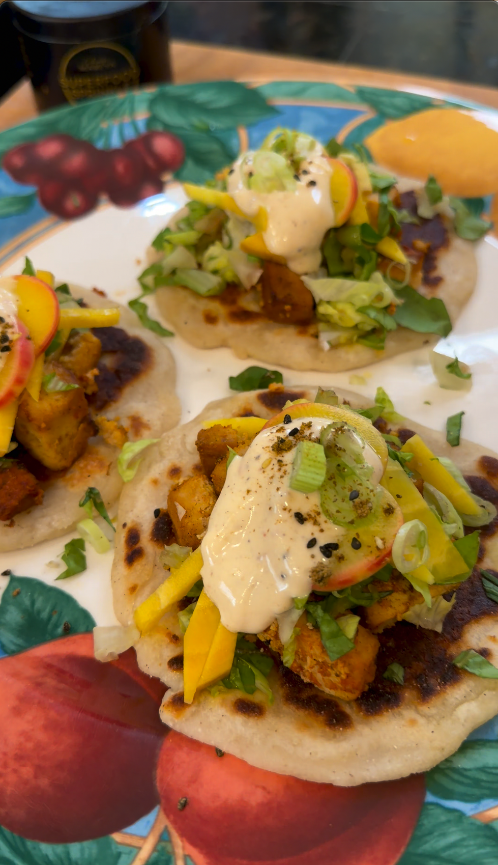 Assembled fava bean curd tacos with pickled beets, cilantro, and lime